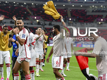 Players from the United Arab Emirates celebrate their victory in the qualification 3rd round for the FIFA World Cup 2026 group A match betwe...