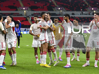 Players from the United Arab Emirates celebrate their victory in the qualification 3rd round for the FIFA World Cup 2026 group A match betwe...