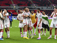 Players from the United Arab Emirates celebrate their victory in the qualification 3rd round for the FIFA World Cup 2026 group A match betwe...