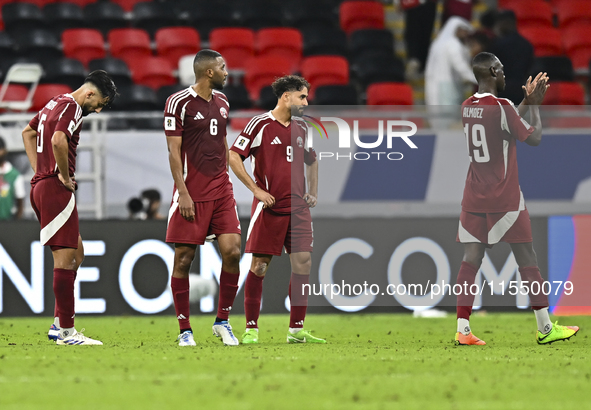 Players of Qatar react after the qualification 3rd round for the FIFA World Cup 2026 group A match between Qatar and United Arab Emirates at...