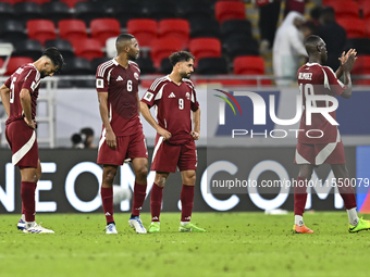 Players of Qatar react after the qualification 3rd round for the FIFA World Cup 2026 group A match between Qatar and United Arab Emirates at...