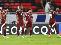 Players of Qatar react after the qualification 3rd round for the FIFA World Cup 2026 group A match between Qatar and United Arab Emirates at...