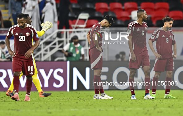 Players of Qatar react after the qualification 3rd round for the FIFA World Cup 2026 group A match between Qatar and United Arab Emirates at...