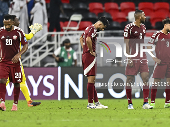 Players of Qatar react after the qualification 3rd round for the FIFA World Cup 2026 group A match between Qatar and United Arab Emirates at...