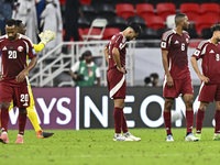 Players of Qatar react after the qualification 3rd round for the FIFA World Cup 2026 group A match between Qatar and United Arab Emirates at...