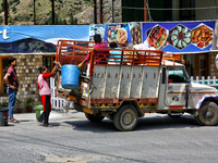 Workers collect trash from a restaurant and hotel in Mussoorie, Uttarakhand, India, on April 18, 2024. (