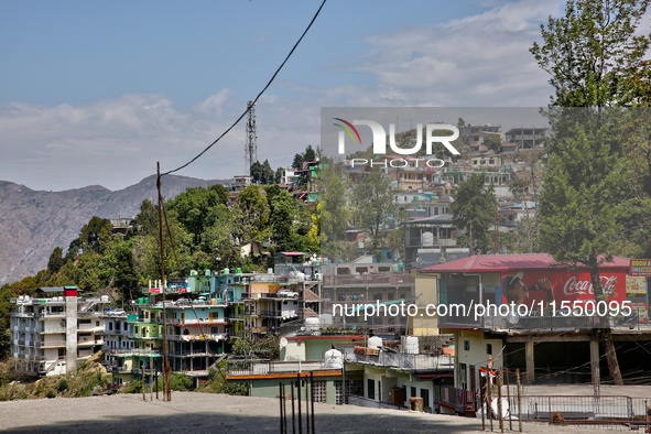 Buildings stand along the mountainside in Mussoorie, Uttarakhand, India, on April 18, 2024. 