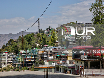 Buildings stand along the mountainside in Mussoorie, Uttarakhand, India, on April 18, 2024. (