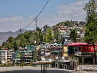 Buildings stand along the mountainside in Mussoorie, Uttarakhand, India, on April 18, 2024. (