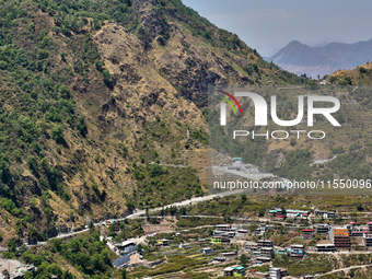 Buildings stand along the mountainside in Mussoorie, Uttarakhand, India, on April 18, 2024. (