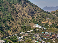 Buildings stand along the mountainside in Mussoorie, Uttarakhand, India, on April 18, 2024. (