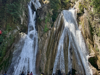 Indian tourists enjoy the cool water at Kempty Falls near the town of Mussoorie, Uttarakhand, India, on April 18, 2024. Kempty Falls is well...