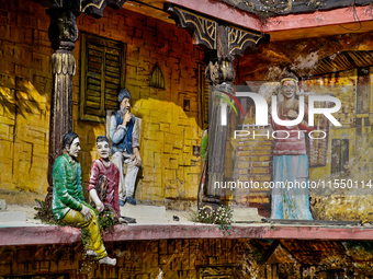 An artistic display depicts Kumaon villagers in a traditional home along the Mall Road in Mussoorie, Uttarakhand, India, on April 18, 2024....