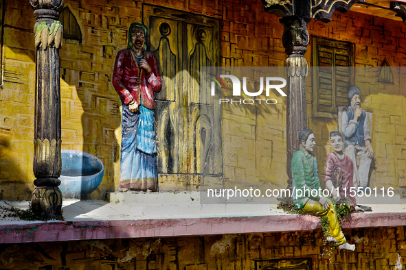 An artistic display depicts Kumaon villagers in a traditional home along the Mall Road in Mussoorie, Uttarakhand, India, on April 18, 2024. 