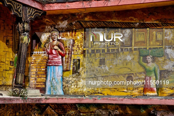 An artistic display depicts Kumaon villagers in a traditional home along the Mall Road in Mussoorie, Uttarakhand, India, on April 18, 2024. 