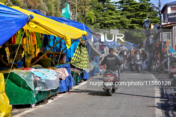 Shops and goods are for sale along the Mall Road in Mussoorie, Uttarakhand, India, on April 18, 2024. 