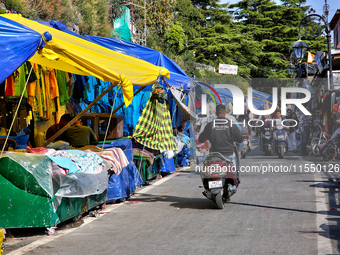 Shops and goods are for sale along the Mall Road in Mussoorie, Uttarakhand, India, on April 18, 2024. (