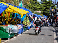 Shops and goods are for sale along the Mall Road in Mussoorie, Uttarakhand, India, on April 18, 2024. (