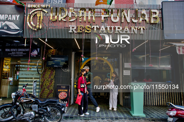 Restaurants line the Mall Road in Mussoorie, Uttarakhand, India, on April 18, 2024. 