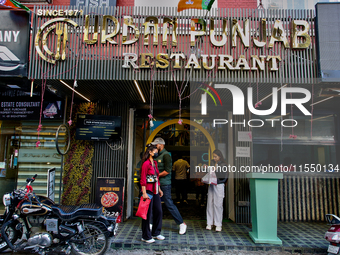 Restaurants line the Mall Road in Mussoorie, Uttarakhand, India, on April 18, 2024. (