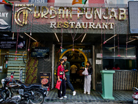 Restaurants line the Mall Road in Mussoorie, Uttarakhand, India, on April 18, 2024. (