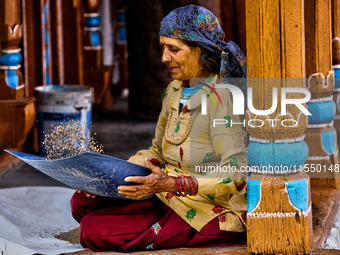 A woman winnows grain in Sainji Village (Corn Village) in Mussoorie, Uttarakhand, India, on April 18, 2024. This village is famous for the b...