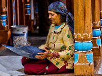 A woman winnows grain in Sainji Village (Corn Village) in Mussoorie, Uttarakhand, India, on April 18, 2024. This village is famous for the b...