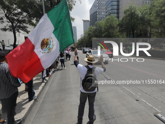 Judiciary workers block the streets near the Senate of Mexico, blocking access to legislators, while demonstrating to protest against the Ju...