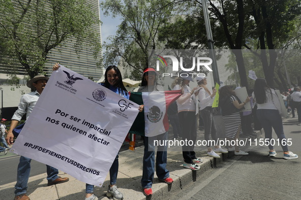 Judiciary workers block the streets near the Senate of Mexico, blocking access to legislators, while demonstrating to protest against the Ju...