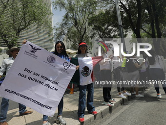 Judiciary workers block the streets near the Senate of Mexico, blocking access to legislators, while demonstrating to protest against the Ju...