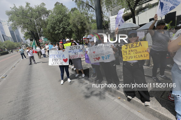 Judiciary workers block the streets near the Senate of Mexico, blocking access to legislators, while demonstrating to protest against the Ju...