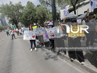 Judiciary workers block the streets near the Senate of Mexico, blocking access to legislators, while demonstrating to protest against the Ju...