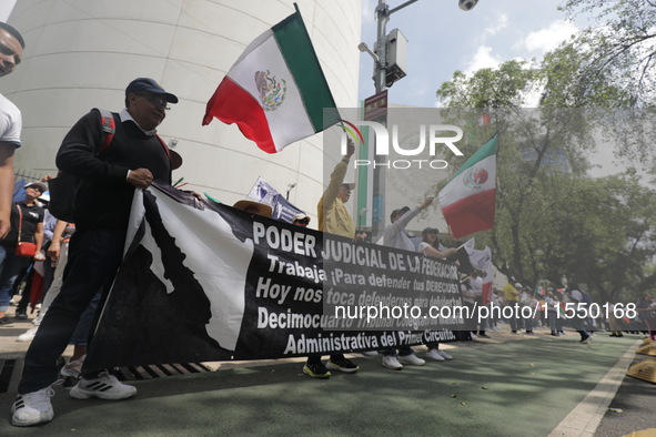 Judiciary workers block the streets near the Senate of Mexico, blocking access to legislators, while demonstrating to protest against the Ju...