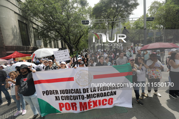 Judiciary workers block the streets near the Senate of Mexico, blocking access to legislators, while demonstrating to protest against the Ju...