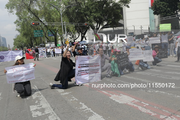 Judiciary workers block the streets near the Senate of Mexico, blocking access to legislators, while demonstrating to protest against the Ju...