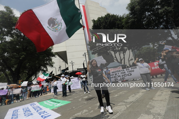 Judiciary workers block the streets near the Senate of Mexico, blocking access to legislators, while demonstrating to protest against the Ju...