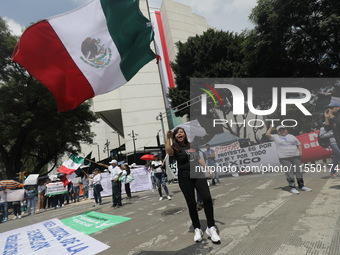 Judiciary workers block the streets near the Senate of Mexico, blocking access to legislators, while demonstrating to protest against the Ju...