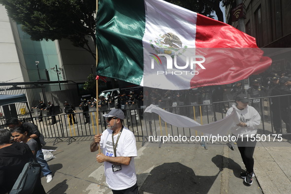 Judiciary workers block the streets near the Senate of Mexico, blocking access to legislators, while demonstrating to protest against the Ju...