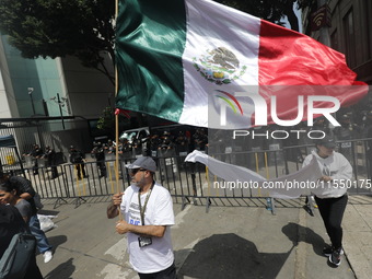 Judiciary workers block the streets near the Senate of Mexico, blocking access to legislators, while demonstrating to protest against the Ju...