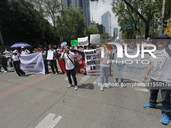 Judiciary workers block the streets near the Senate of Mexico, blocking access to legislators, while demonstrating to protest against the Ju...