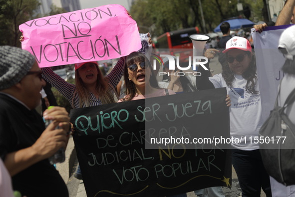 Judiciary workers block the streets near the Senate of Mexico, blocking access to legislators, while demonstrating to protest against the Ju...