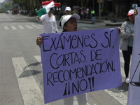 Judiciary workers block the streets near the Senate of Mexico, blocking access to legislators, while demonstrating to protest against the Ju...