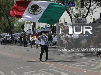 Judiciary workers block the streets near the Senate of Mexico, blocking access to legislators, while demonstrating to protest against the Ju...