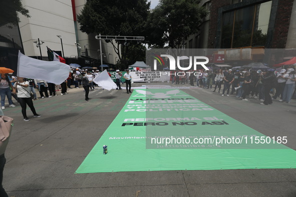 Judiciary workers block the streets near the Senate of Mexico, blocking access to legislators, while demonstrating to protest against the Ju...