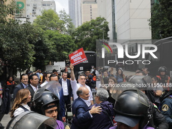 Alejandro Moreno Cardenas, National President of the Partido Revolucionario Institucional (PRI), joins the judiciary workers demonstrating t...