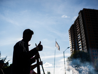 Truck drivers and their relatives take part in a community lunch and camp in northern Bogota, as truckers demonstrate against the increase i...