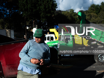 Truck drivers and their relatives take part in a community lunch and camp in northern Bogota, as truckers demonstrate against the increase i...