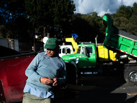 Truck drivers and their relatives take part in a community lunch and camp in northern Bogota, as truckers demonstrate against the increase i...