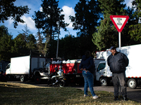 Truck drivers and their relatives take part in a community lunch and camp in northern Bogota, as truckers demonstrate against the increase i...