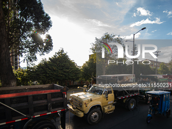 Rows of parked trucks are seen as truckers demonstrate against the increase in diesel prices in Bogota, Colombia, on September 5, 2024. (